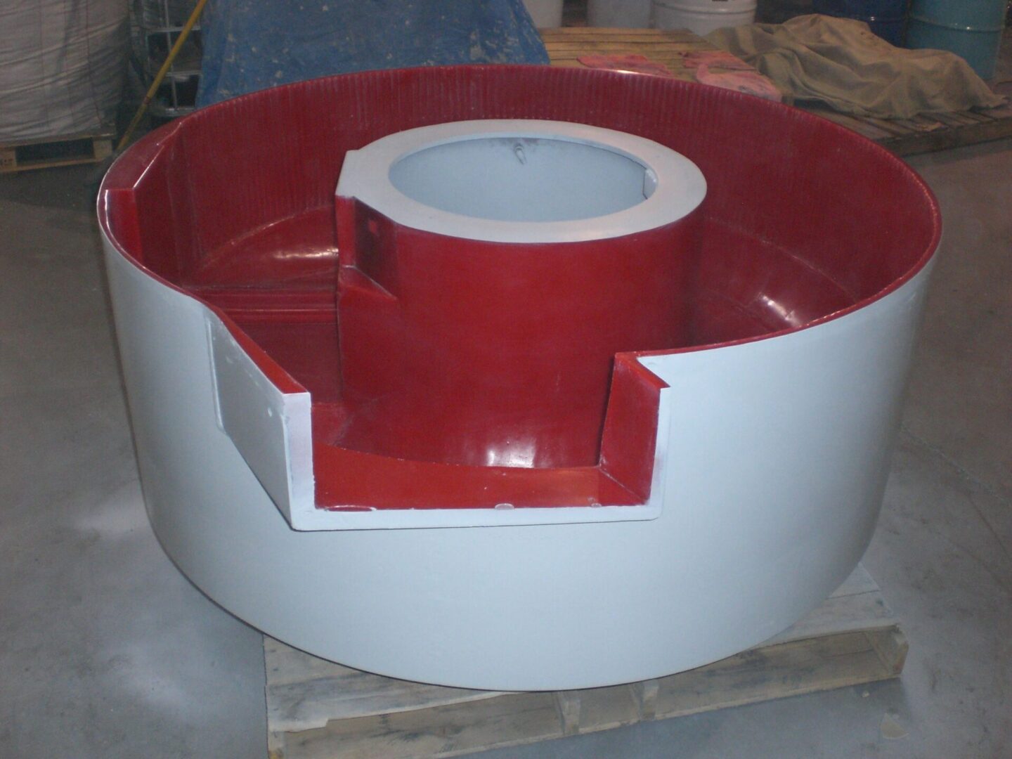 A red and white bowl sitting on top of a table.