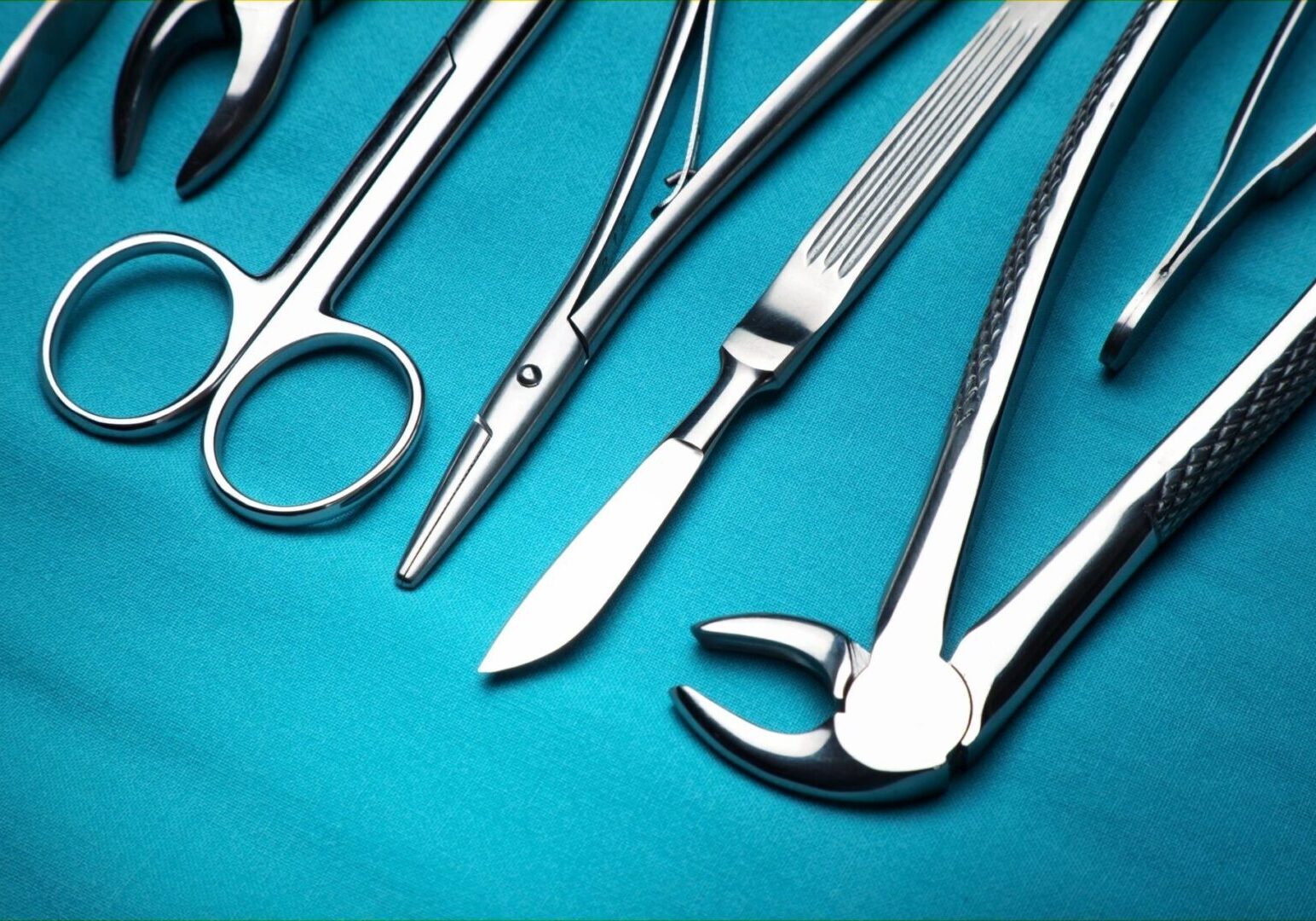 A blue table with several different types of medical instruments.